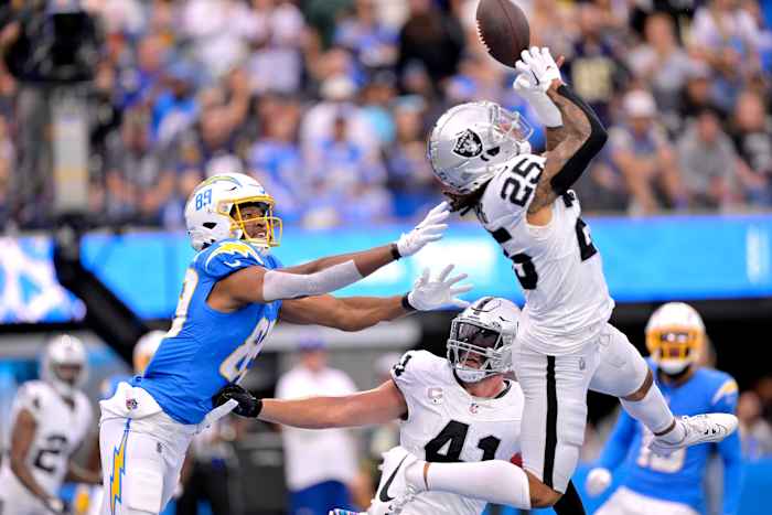 Oct 1, 2023; Inglewood, California, USA; Las Vegas Raiders safety Tre'von Moehrig (25) deflects a pass in the end zone intended for Los Angeles Chargers tight end Donald Parham Jr. (89) in the first half at SoFi Stadium. Mandatory Credit: Jayne Kamin-Oncea-USA TODAY Sports